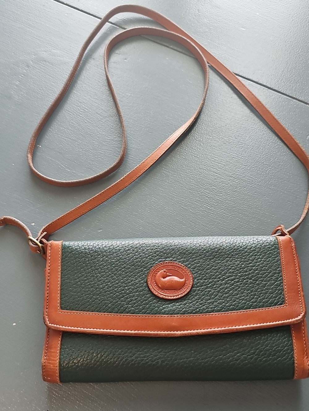 Dooney & Bourke All Leather Crossbody Clutcn. Green/tan